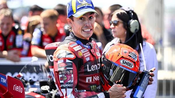 Marc Marquez pembalap Ducati Lenovo Team memegang helm saat menghadiri paddock MotoGP
